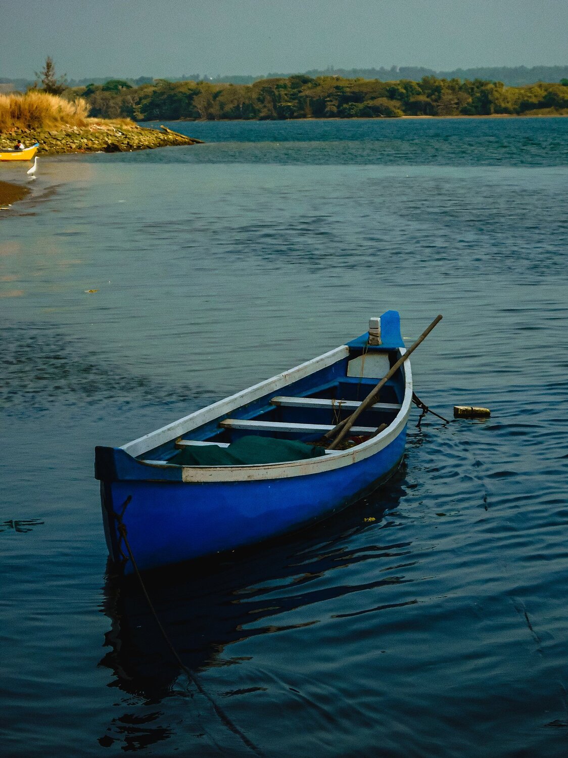 Blue boat on blue water......