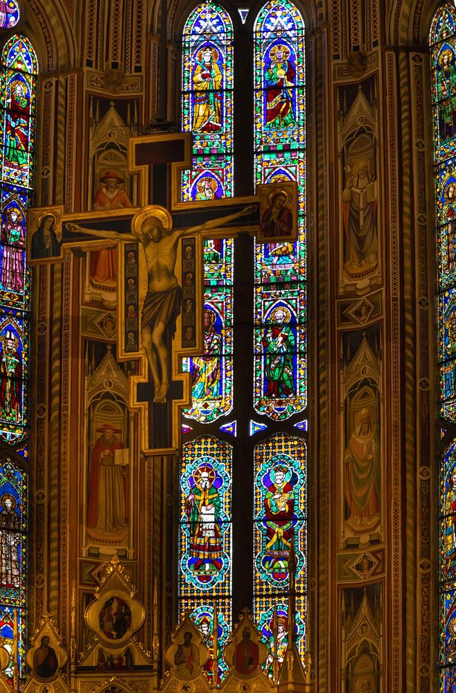 Crucifix and stained glass window in Basilica di Santa Croce, Florence.