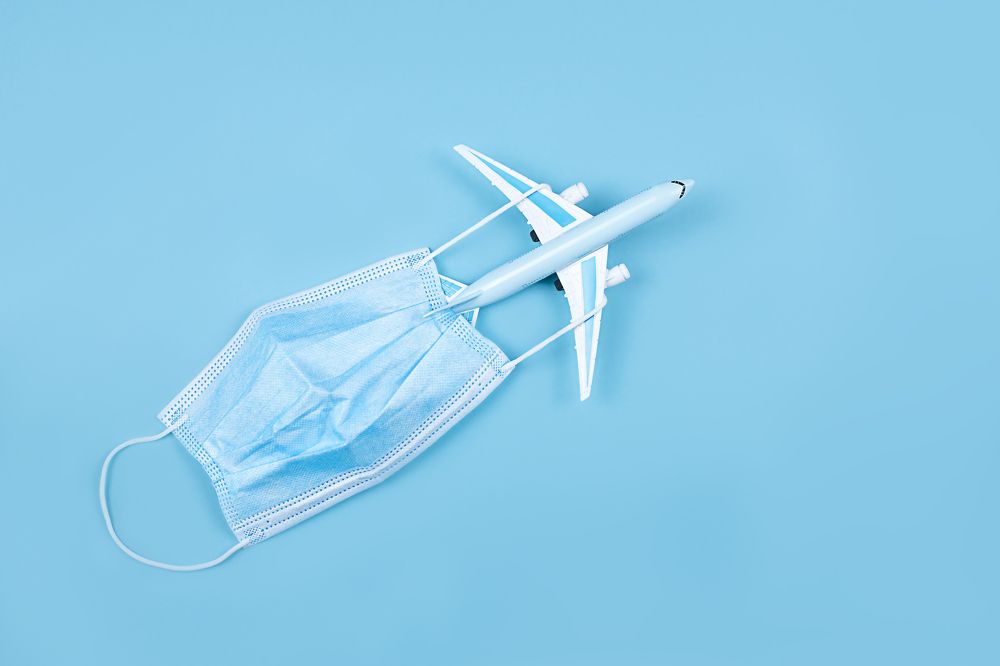 Airplane in flight with a medical mask