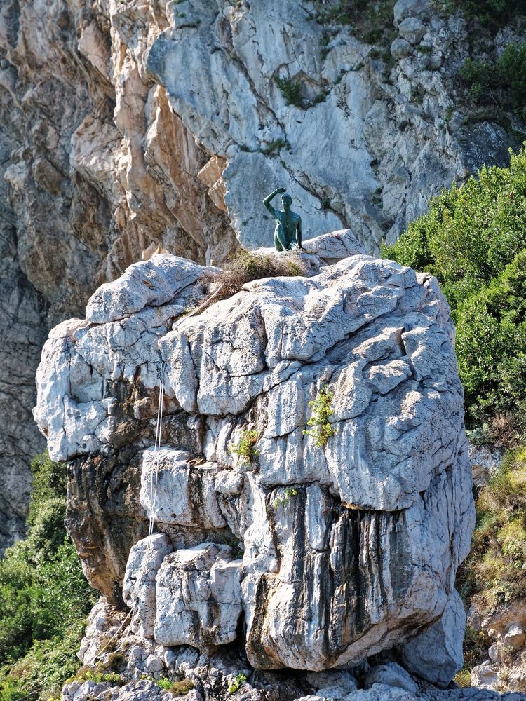 Titan's nest; statue on top of large cliff, Capri island