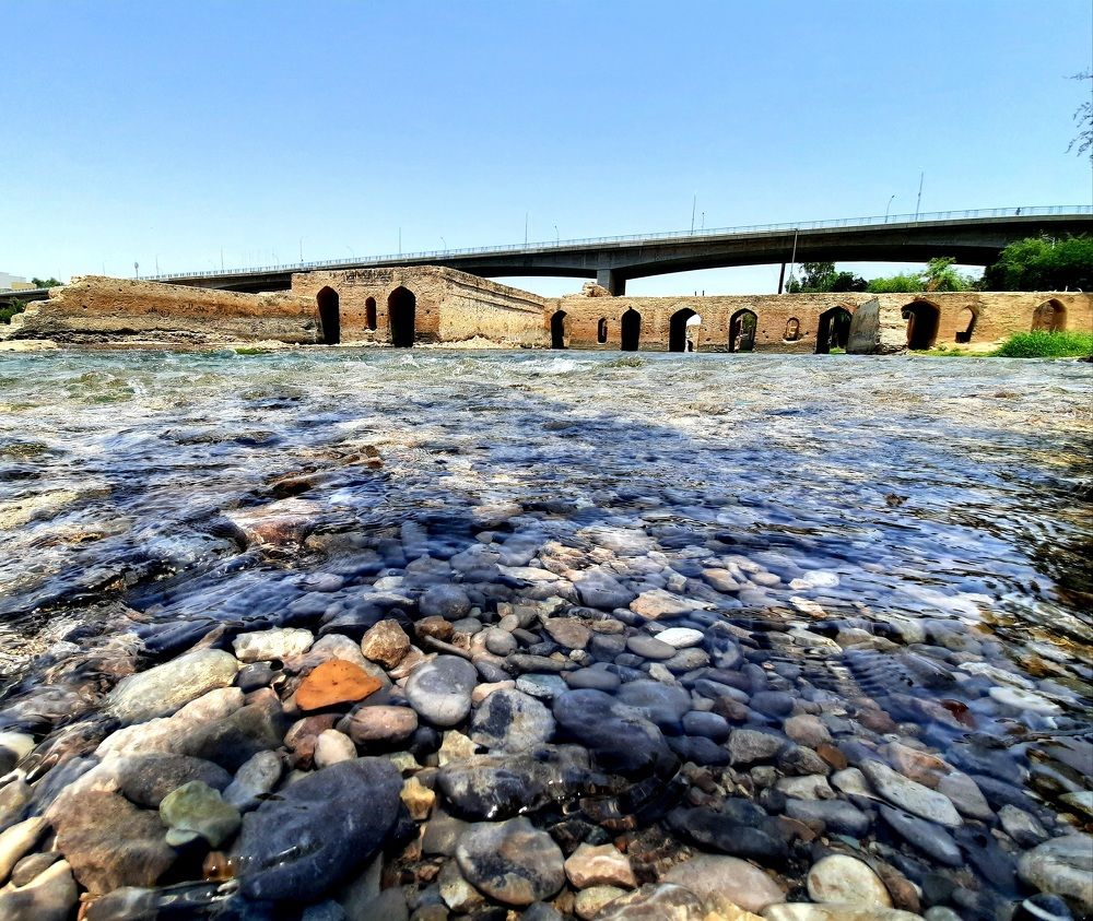 Very old houses that the river now crosses