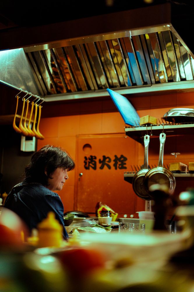 Cleaning lady washing dishes