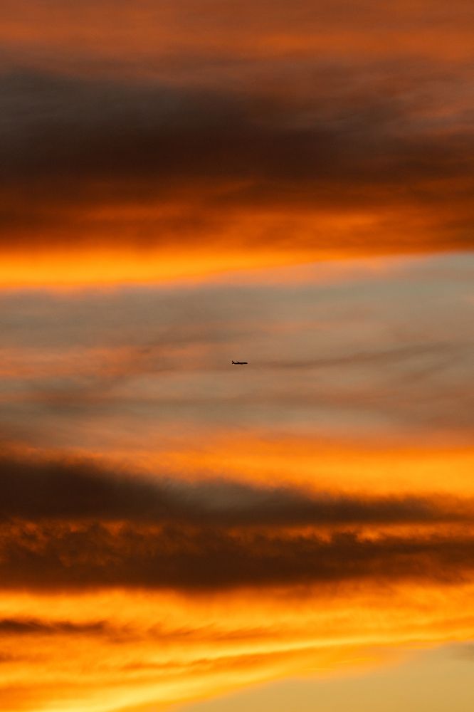 Airplane on Clouds of Fire