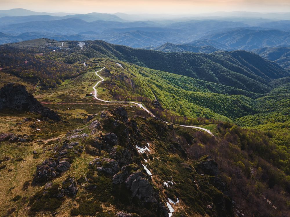 Mountain Range With Road Heading Through