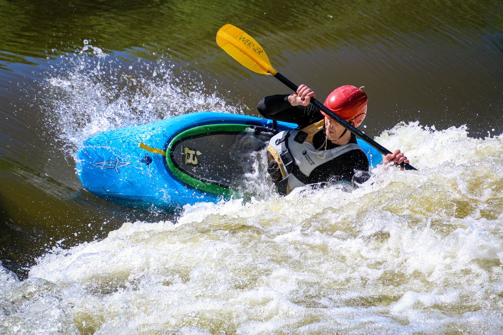 White water action. Rodeo kayaking move.