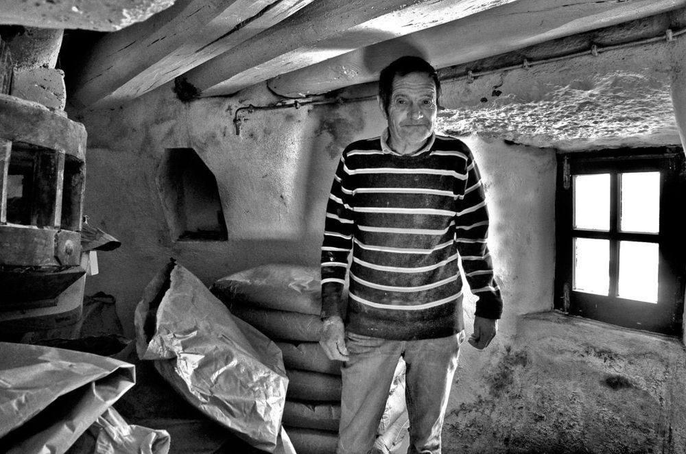 The man who makes the flour for our breads in the traditional way.