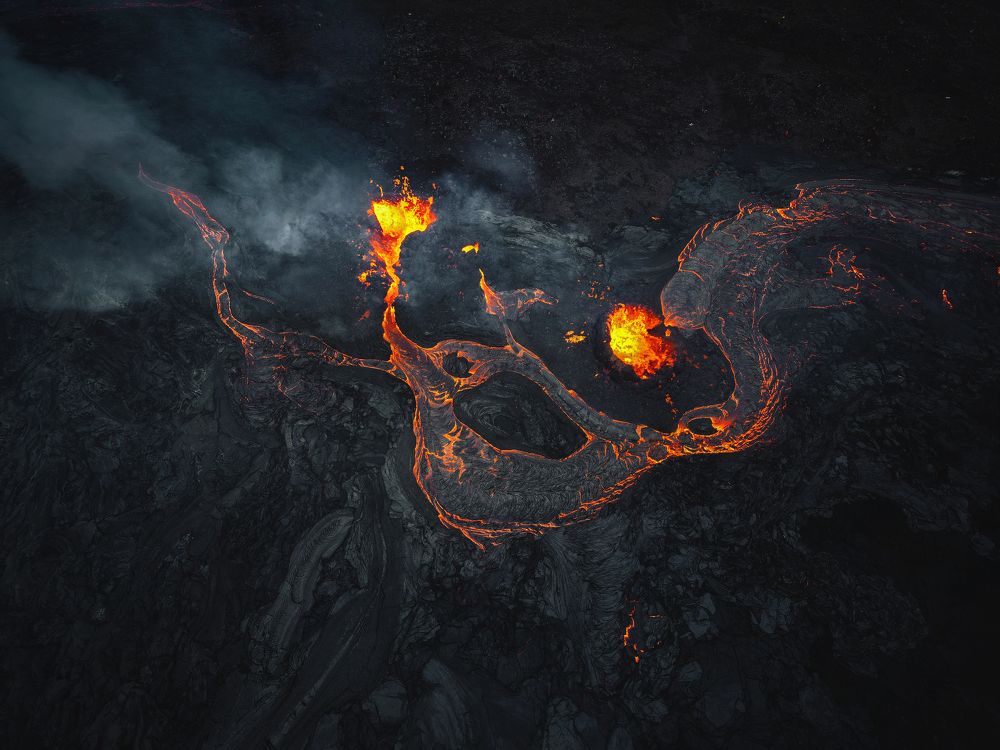 2 fissure openings spreading new lava on the top of the old lava