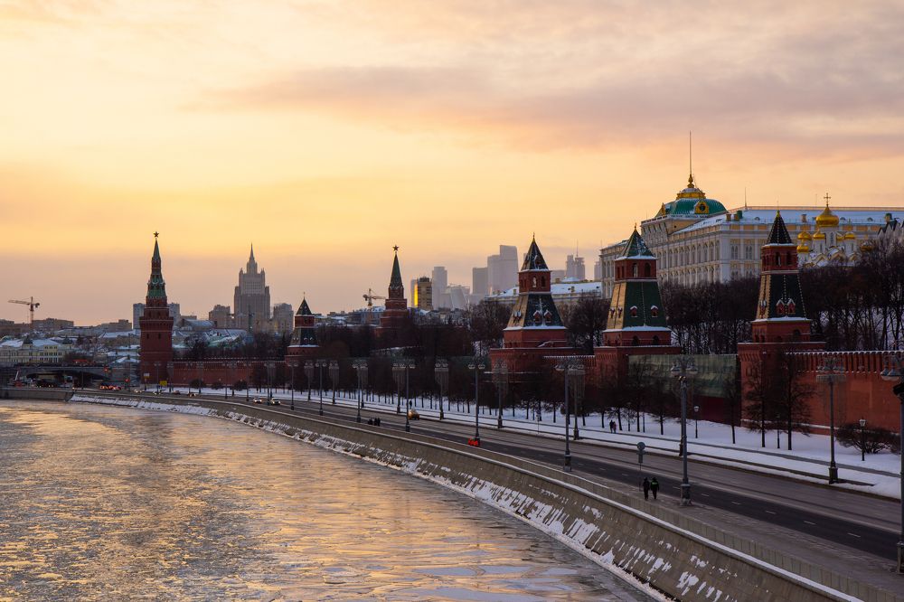 Orange sunset over the Kremlin. The ice on the Moscow river has broken.