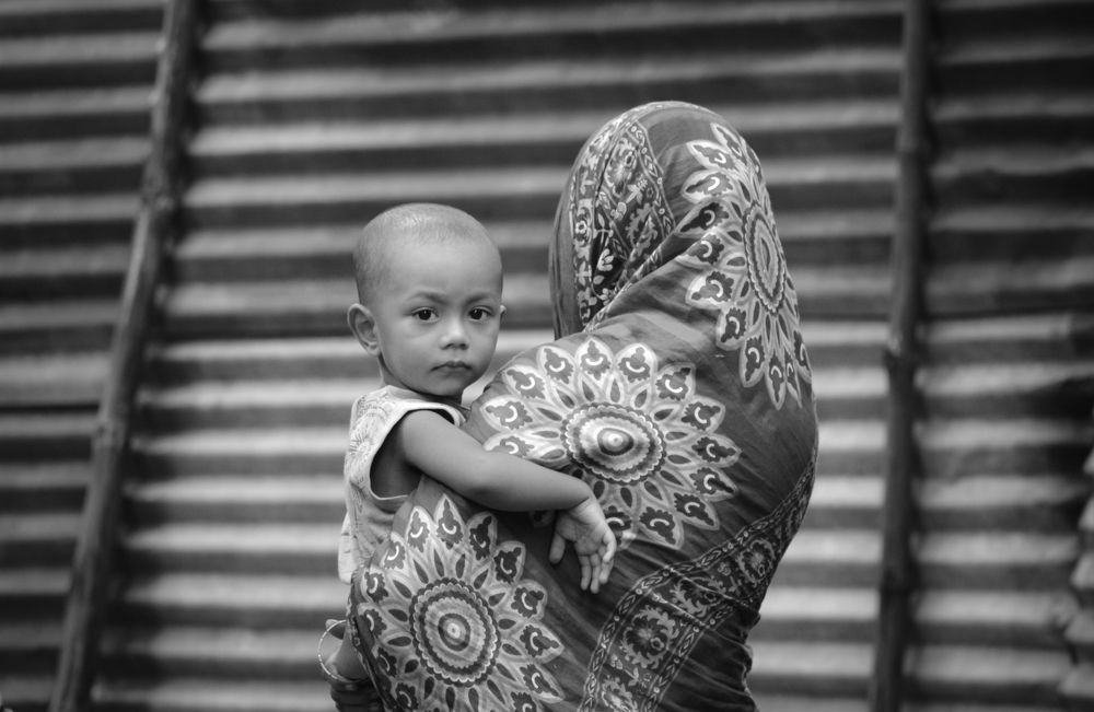 Baby in mother's lap.