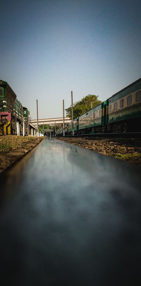 Railway track leads towards destination.
