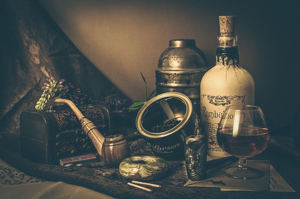 Still life with smoking pipes and rum