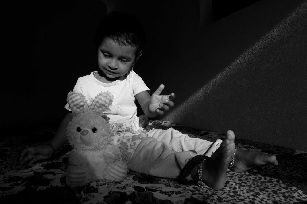 girl baby playing wiith toy