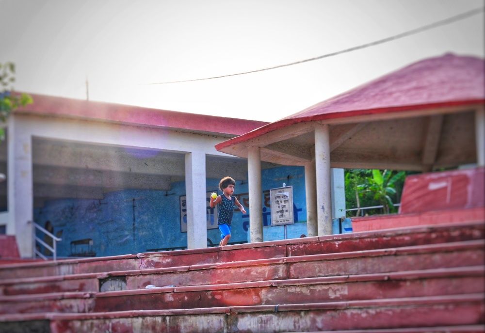 A girl playing with ball ....