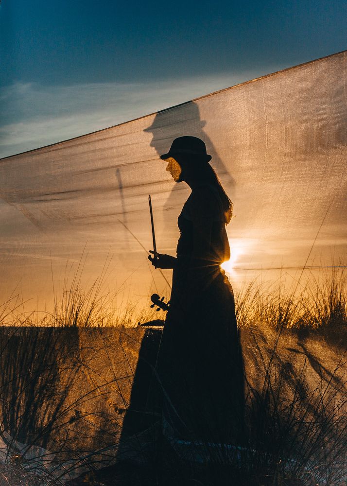 Violinist at sunset