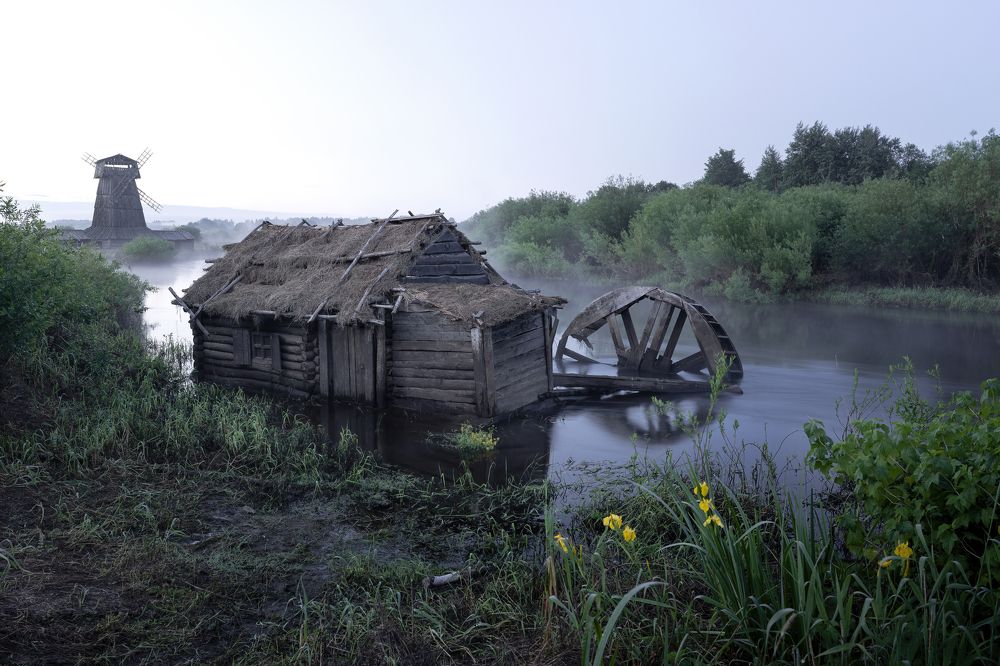 An old mill on the river in the early morning.