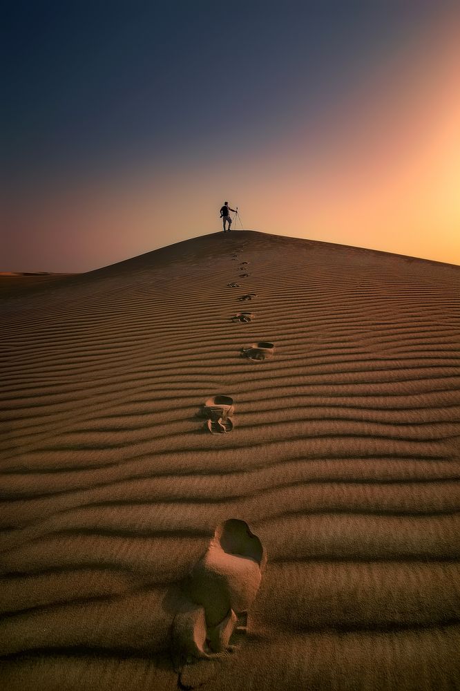 Photographer in desert Saudi Arabia
