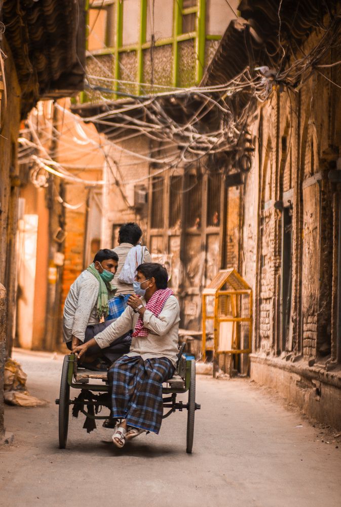 Men traveling on cycle cart during lockdown due to covid-19