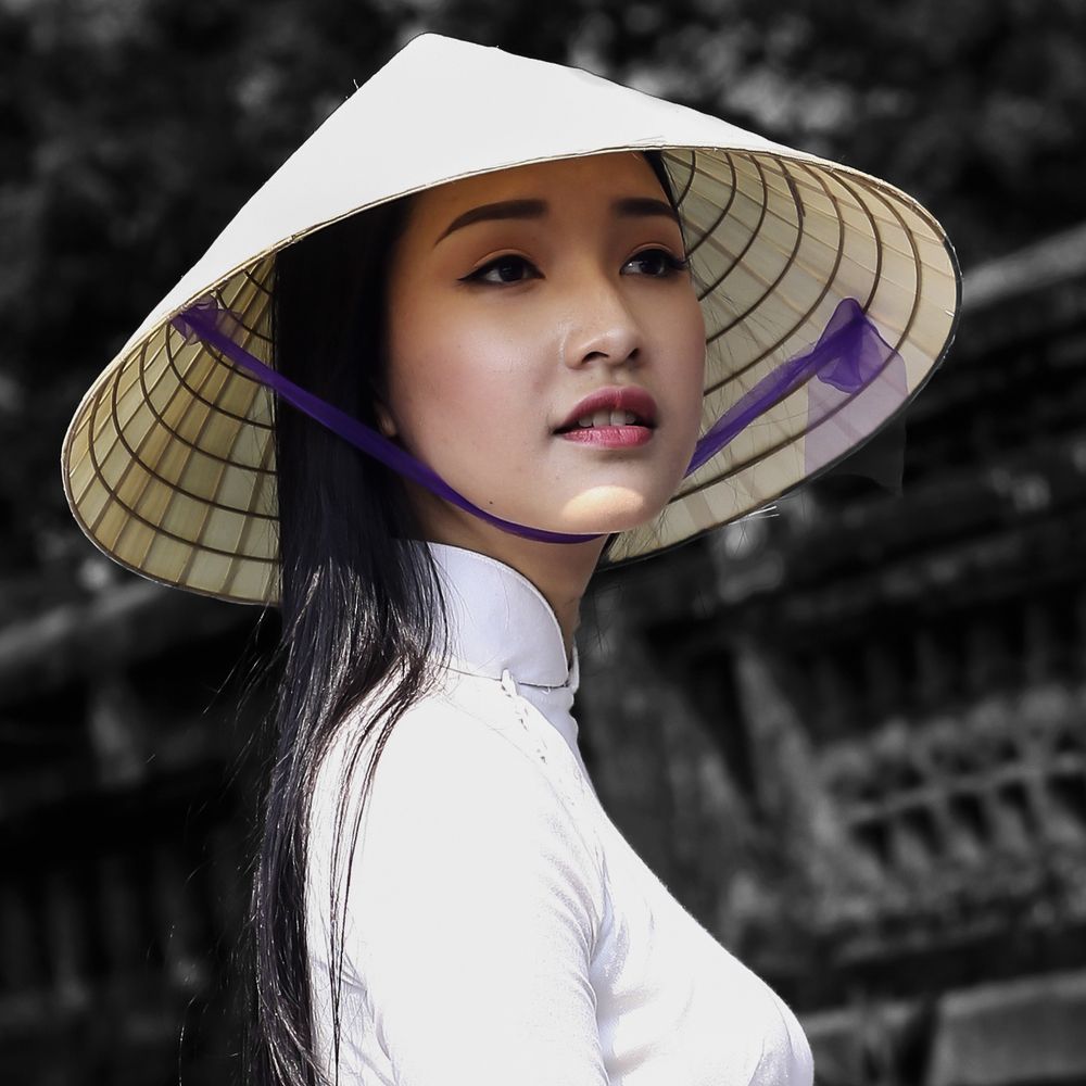 Hue girl with a poem hat