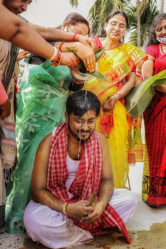 Turmeric to the body - a ceremonial process of bengali traditional  marriage
