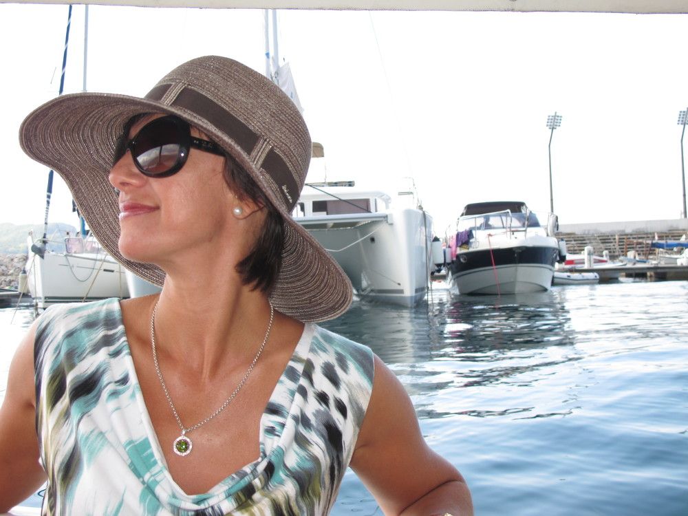 Woman in a hat on a yacht