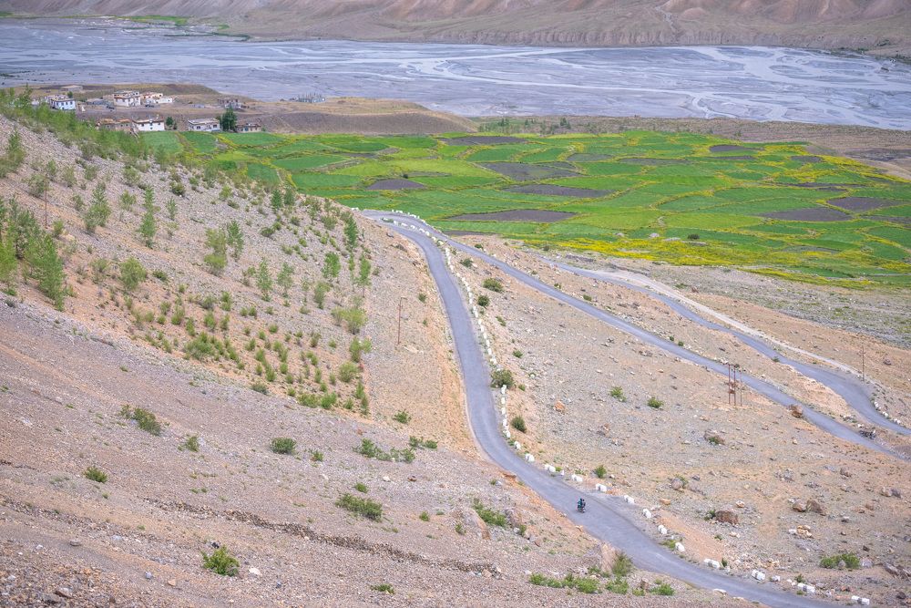 Biker on the river shore
