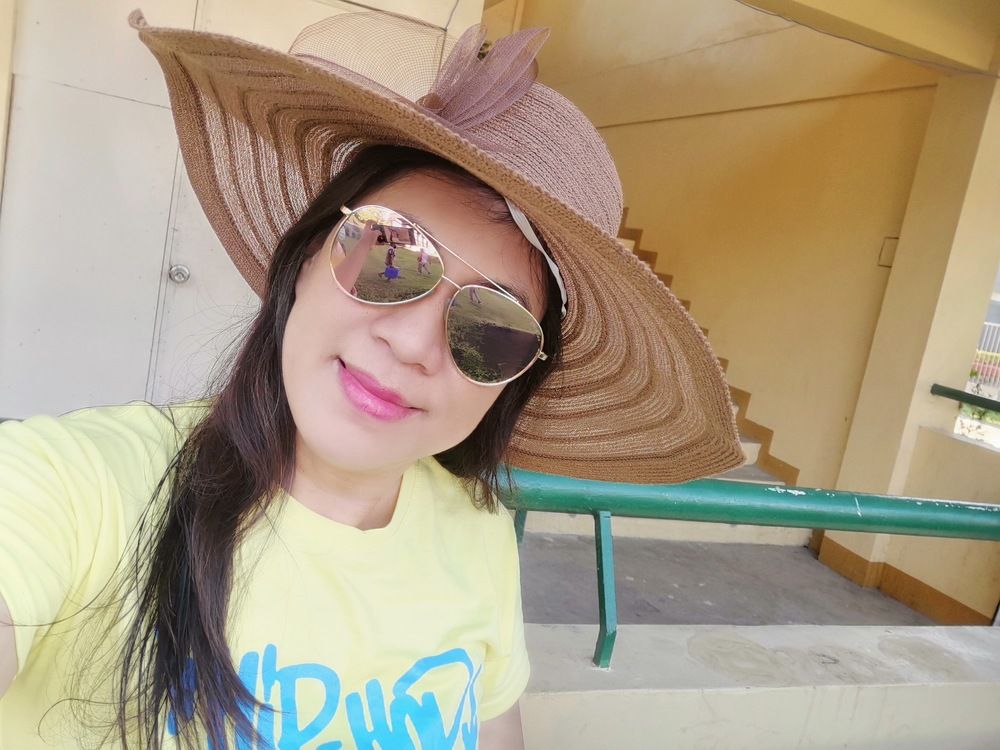 A woman in love with a hat