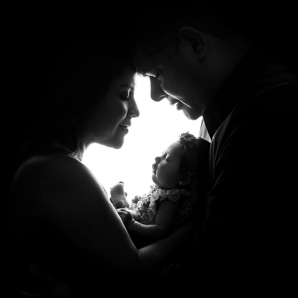 Family with Newborn baby girl.