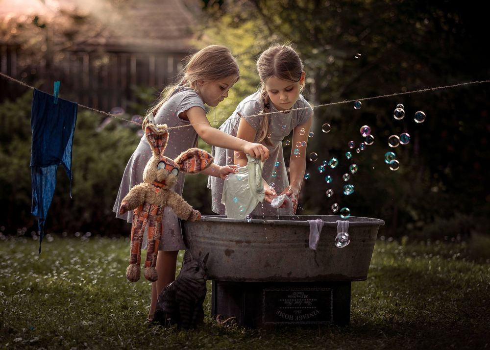 Two girls doing laundry
