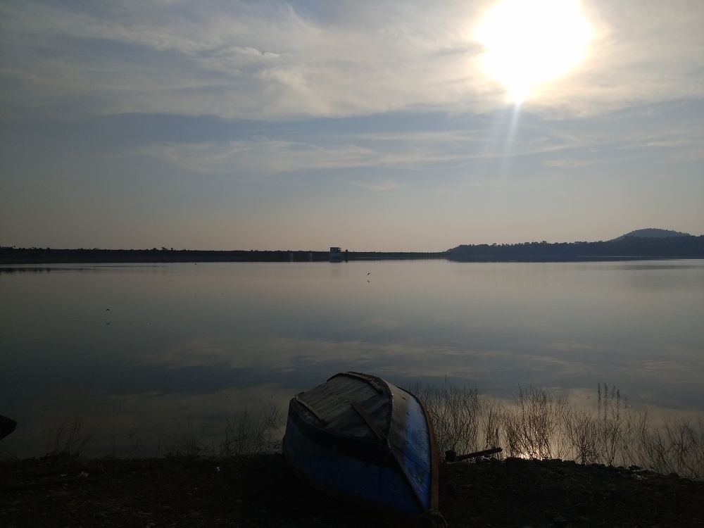 Boat on Shore of the reservoir water