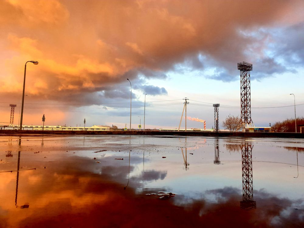 reflection of the sky in a puddle