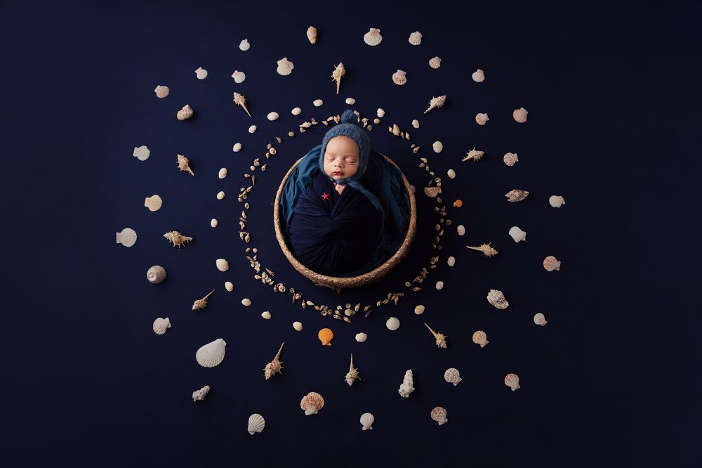 Tomás with seashells