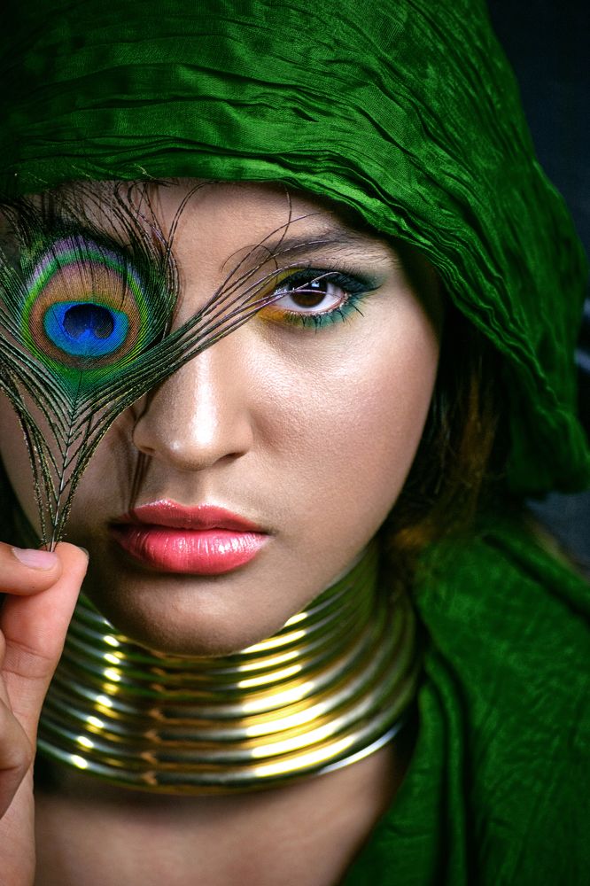 Girl with peacock feather