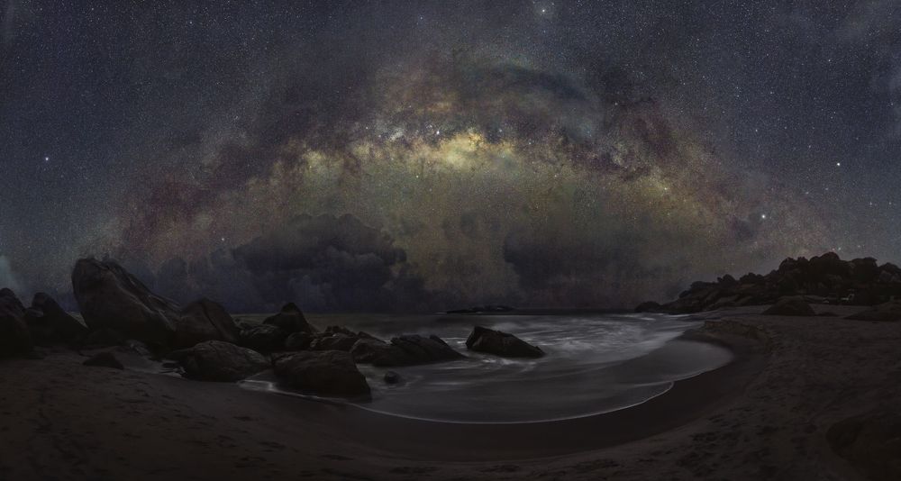 Milky way through rainy clouds