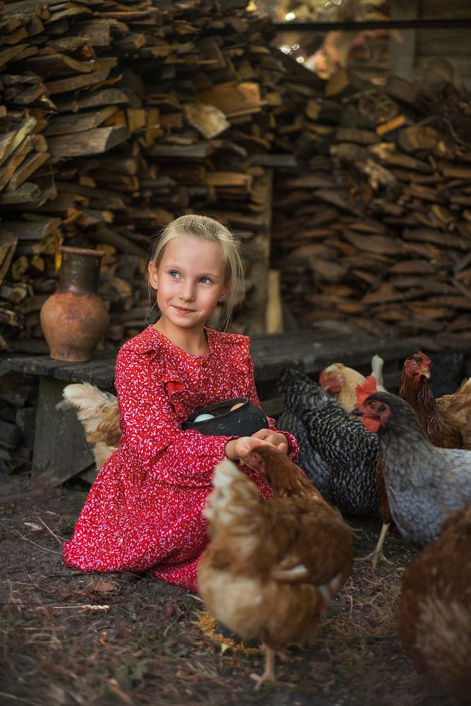 girl and chickens