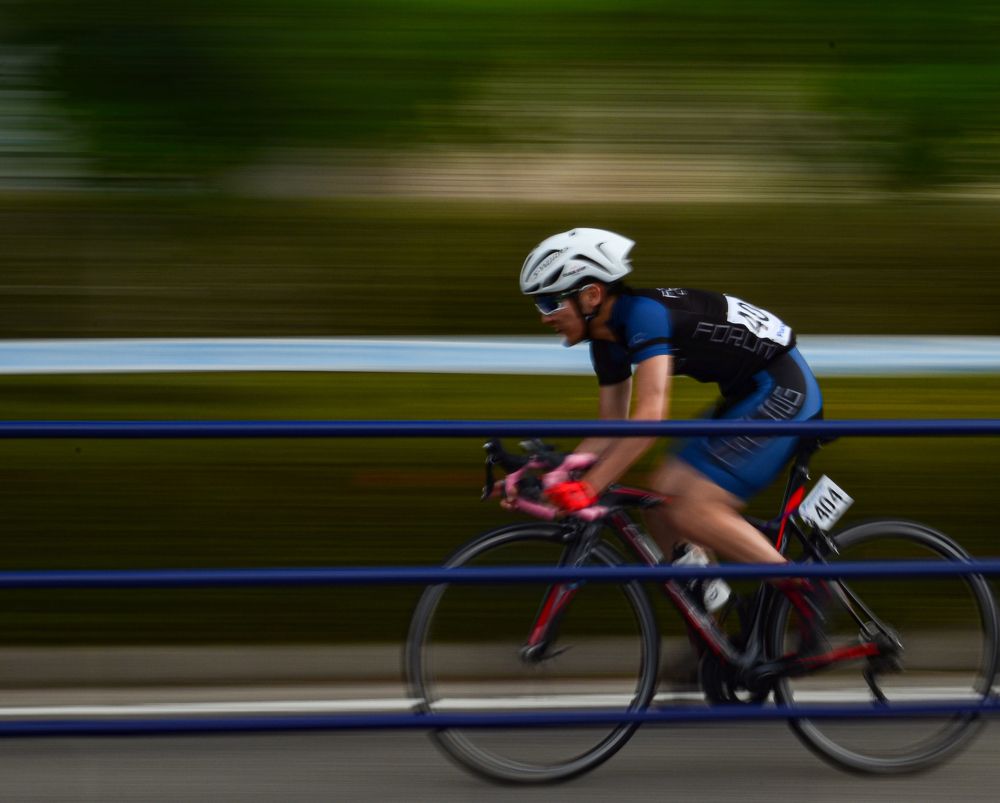 A cyclist races his bike to the finish line