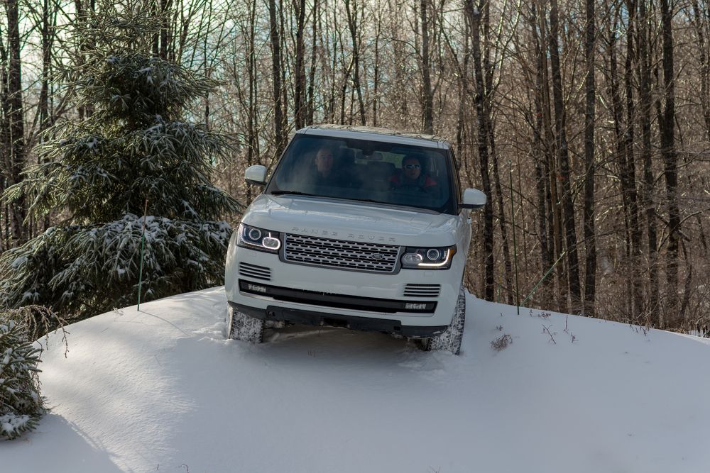2013 White Range Rover during winter off-road at the Montebello Land Rover Experience facility.