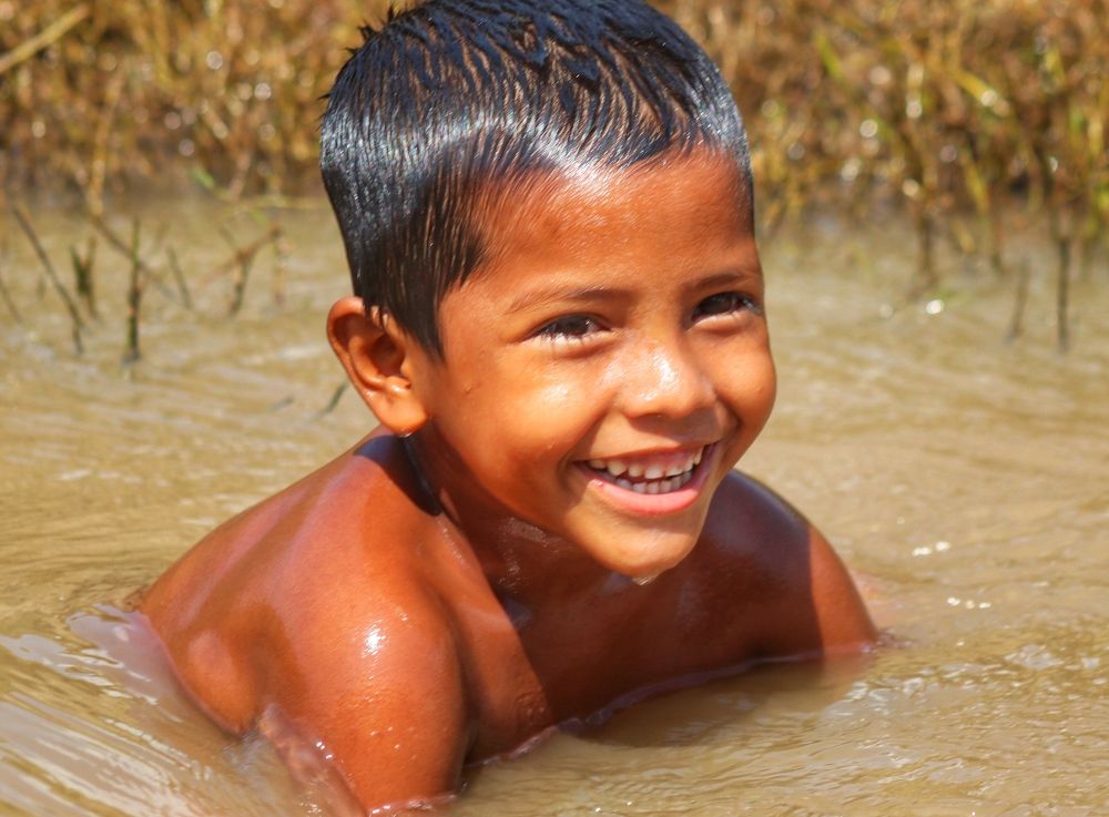 Little boy swimming in water