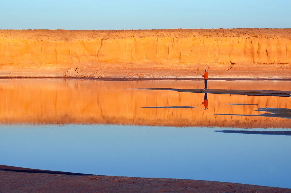 blues by the river at sunset