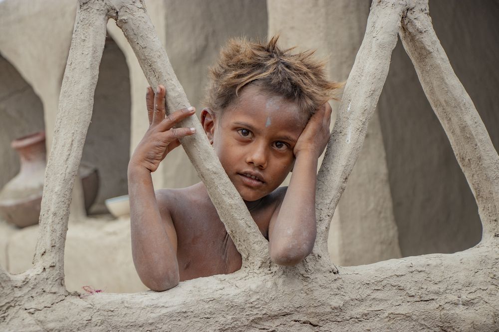 A Village Boy, Standing And Looking At Camera In Sindh