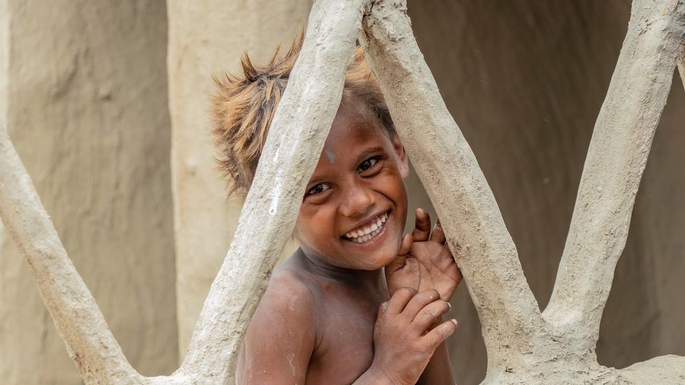 Village boy, smiling
