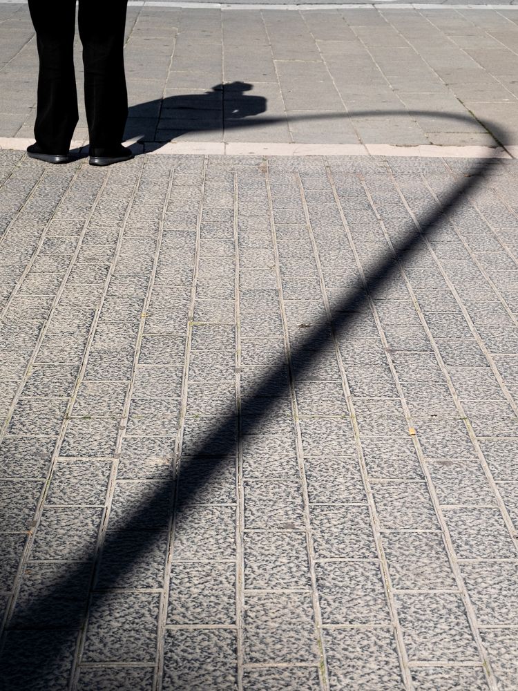 The legs, the shadow and the lamppost