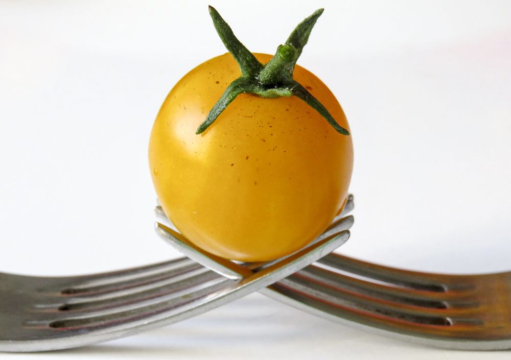 Yellow cherry tomato on forks