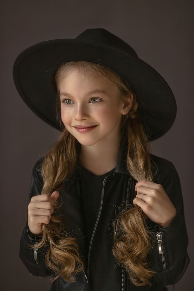 The girl in the hat.