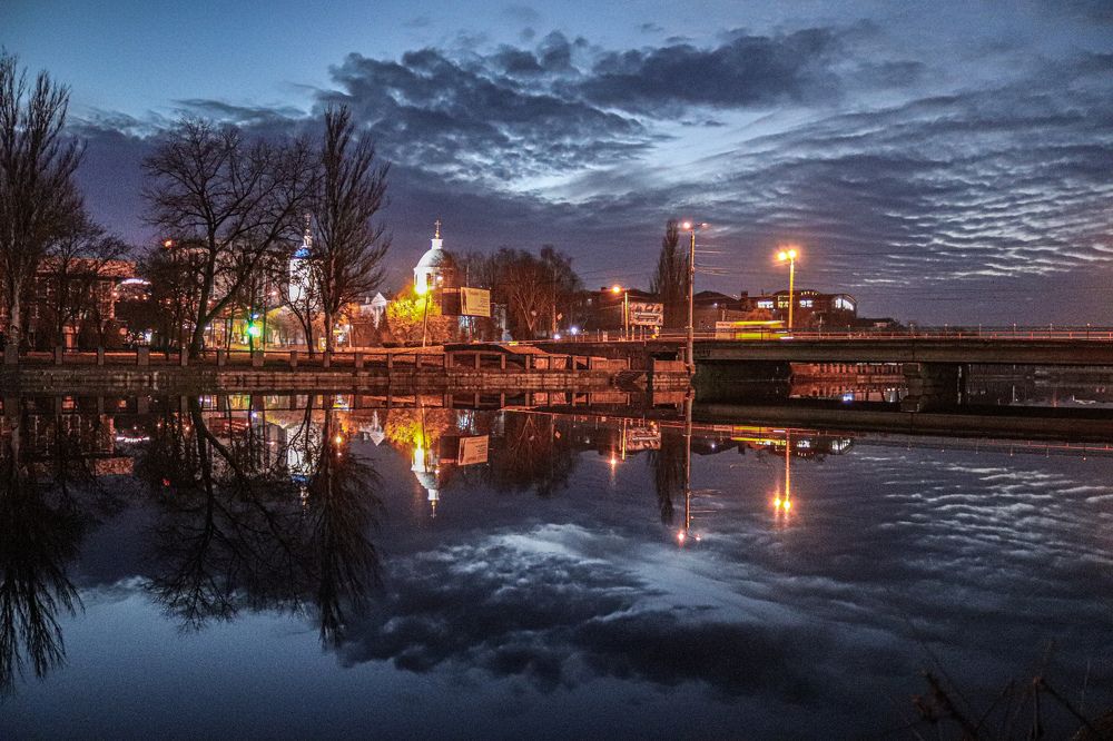 Water reflection in cloudy weather near the bridge