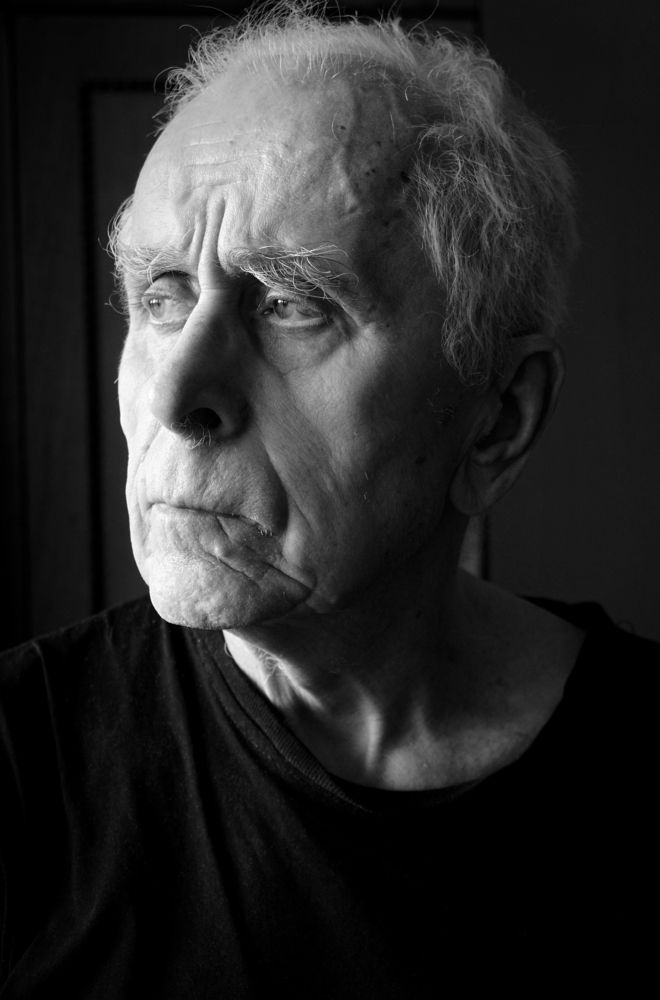 Около окна.