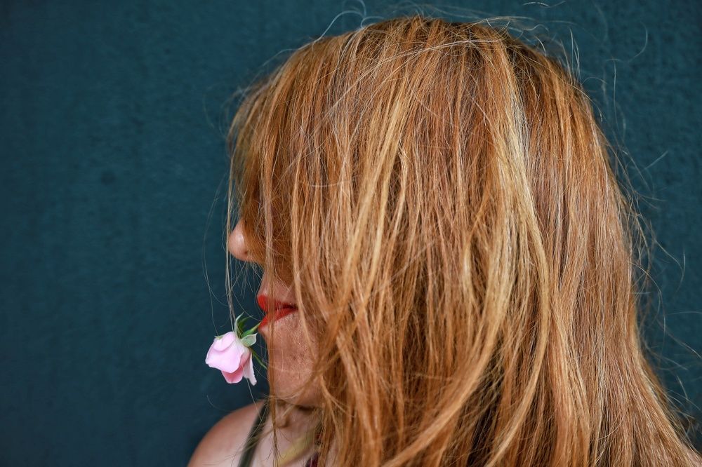 Girl with pink rose..