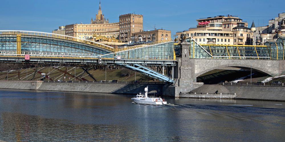 About big and small. A bridge and a small ship.