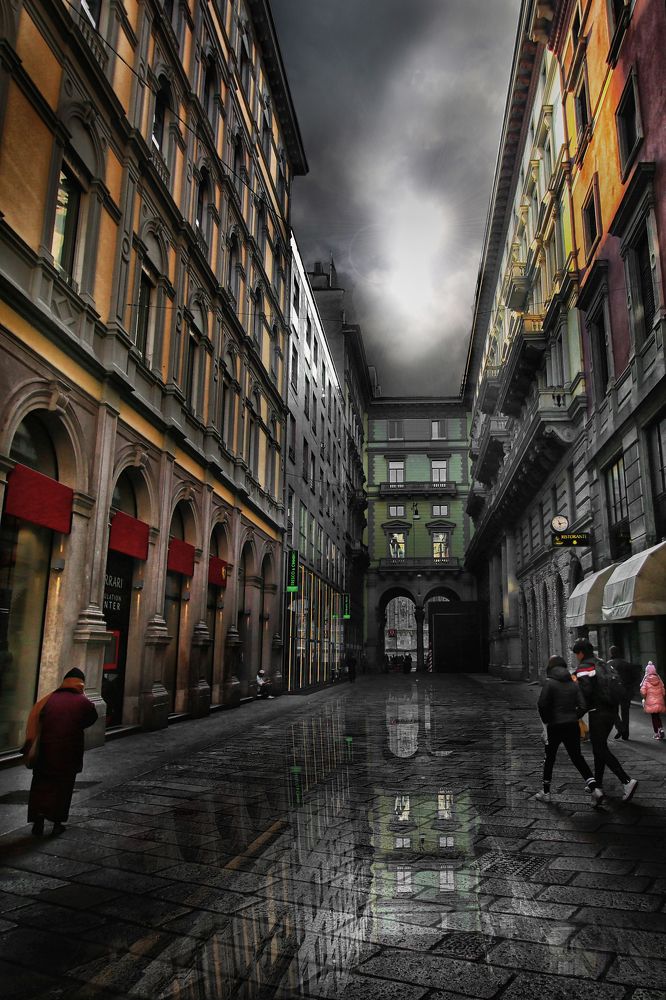 Milan reflected in the rainwater