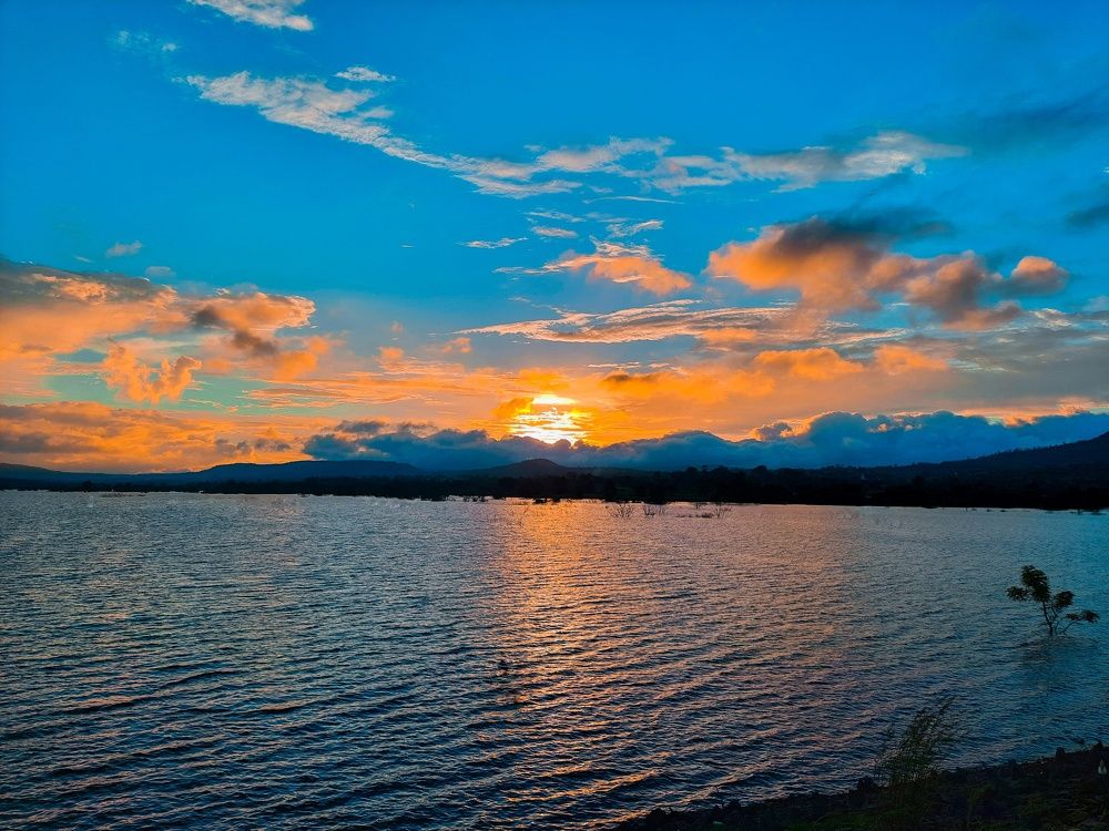 The water was glassy and calm, still candy-colored in the afterglow of sunset.