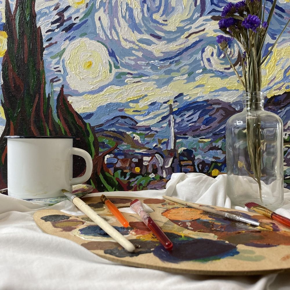 Still life with Vincent van Gogh's Starry Night